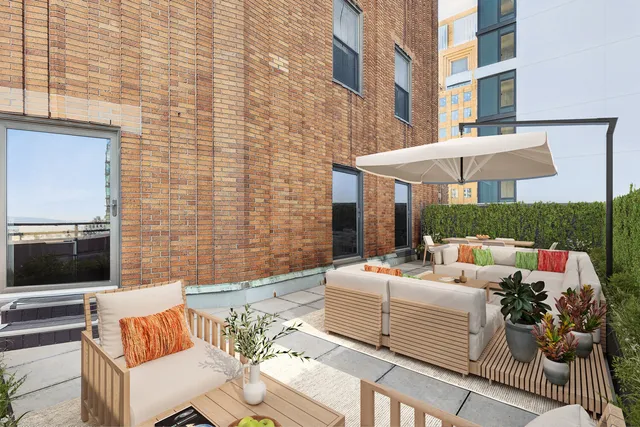 a outdoor living space with furniture and a fireplace