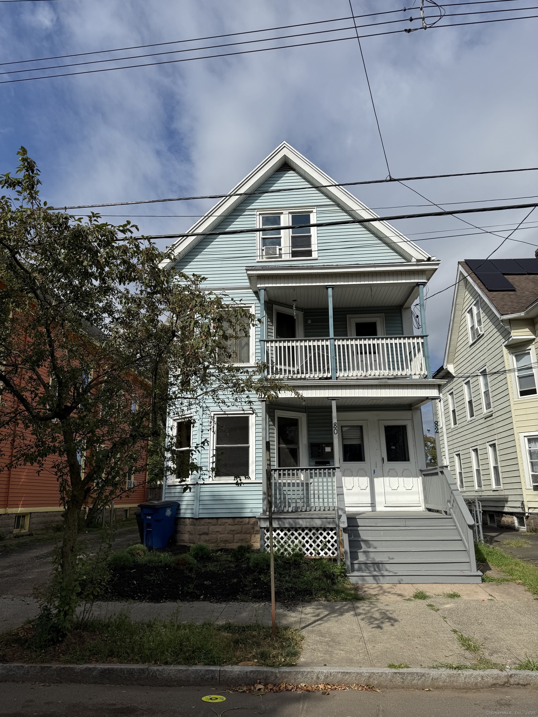 a front view of a house with a porch