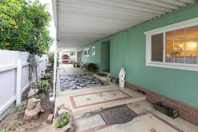 a backyard of a house with seating space