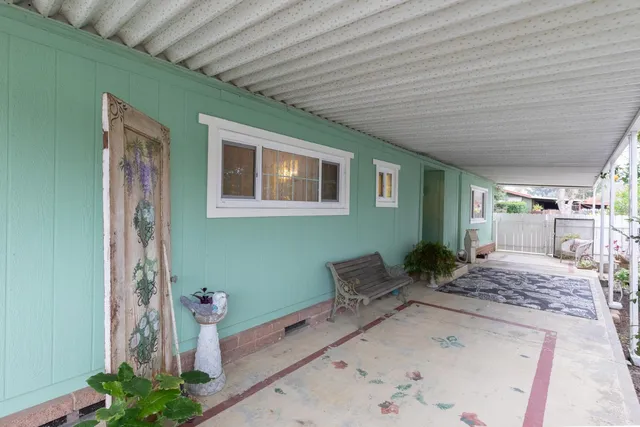 a very nice looking dining room with furniture wooden floor and chandelier