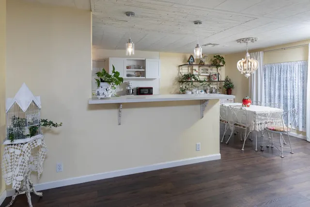 a bedroom with a bed and a table in it