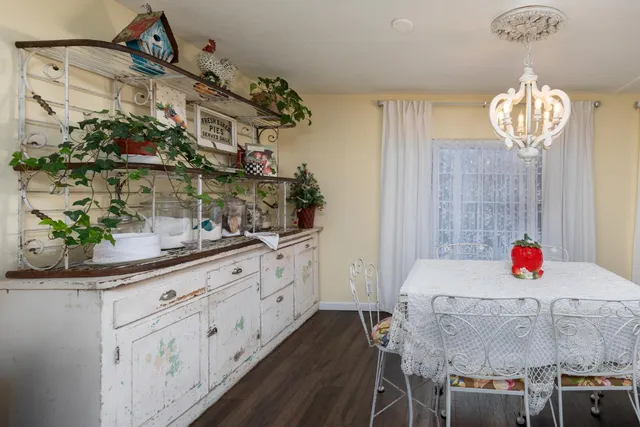 a room with stainless steel appliances a sink and cabinets