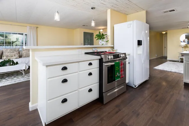 a utility room with sink dryer and washer