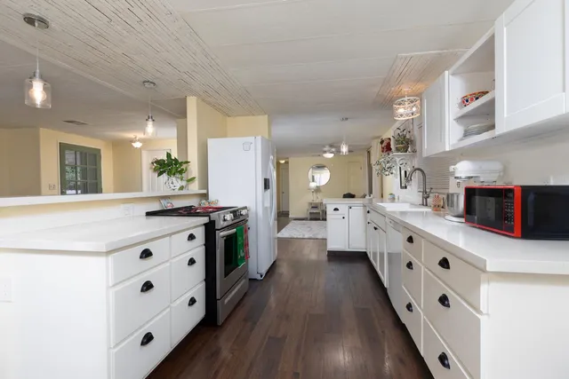 a bedroom with a bed and a television