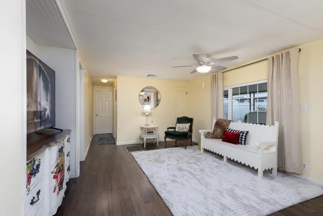 a bathroom with a tub a sink and a mirror