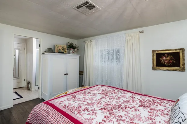 swimming pool view with a seating space and a garden view