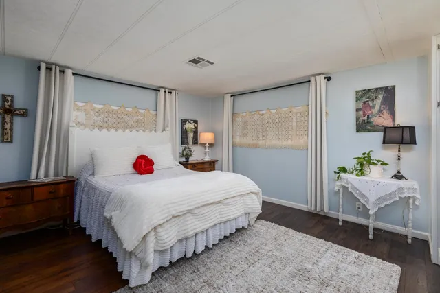 a view of balcony with wooden floor and fence