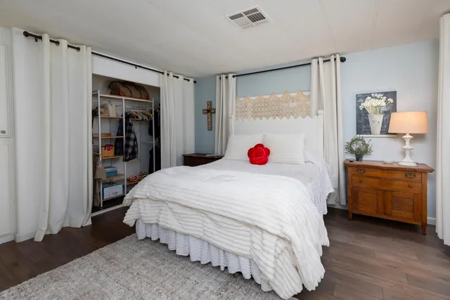 a view of a house with a yard and a fountain