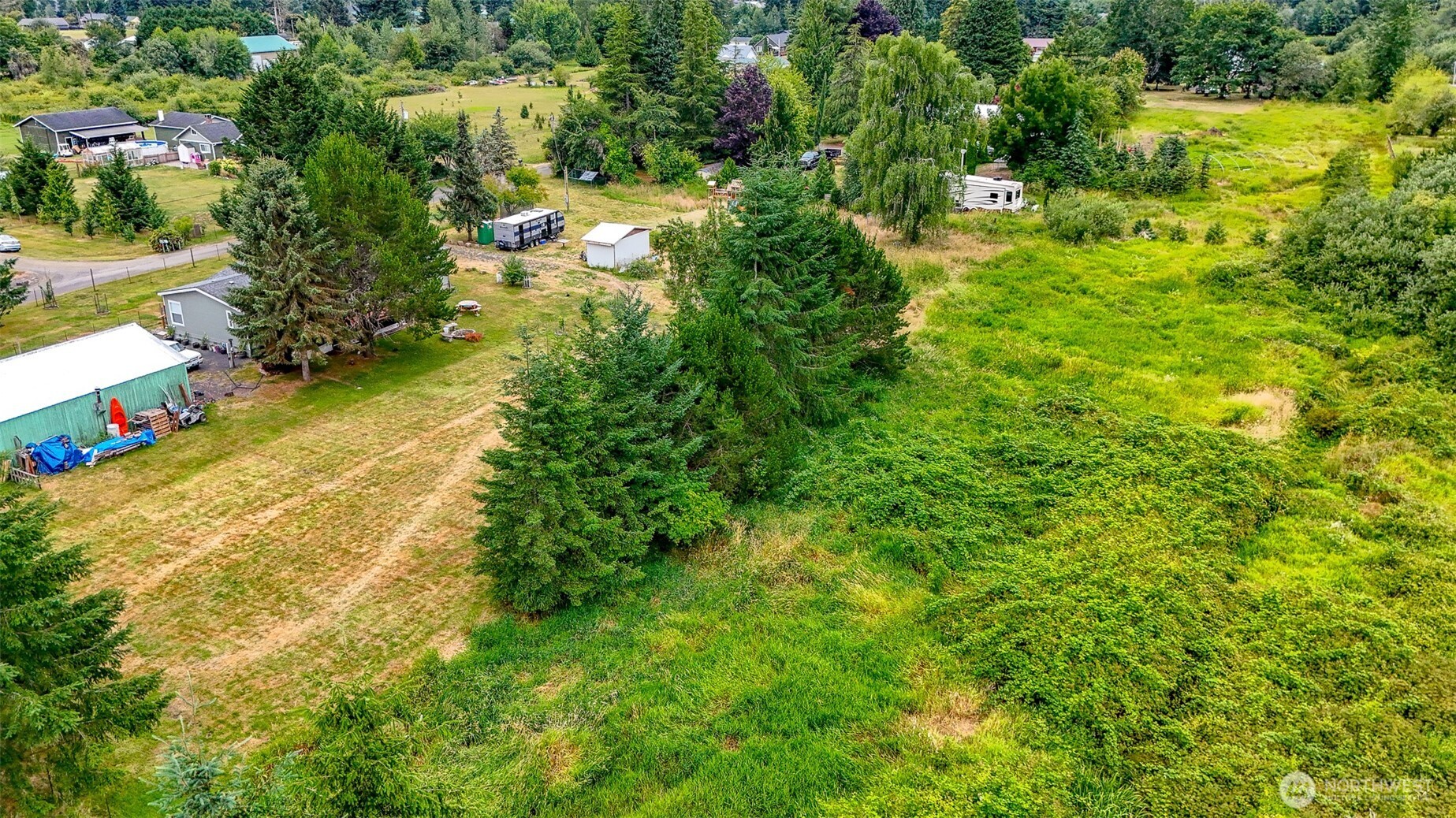 23 Garden Tracts Road Montesano, WA 98563 - Photo 16 of 22 a view of a large trees with flower garden
