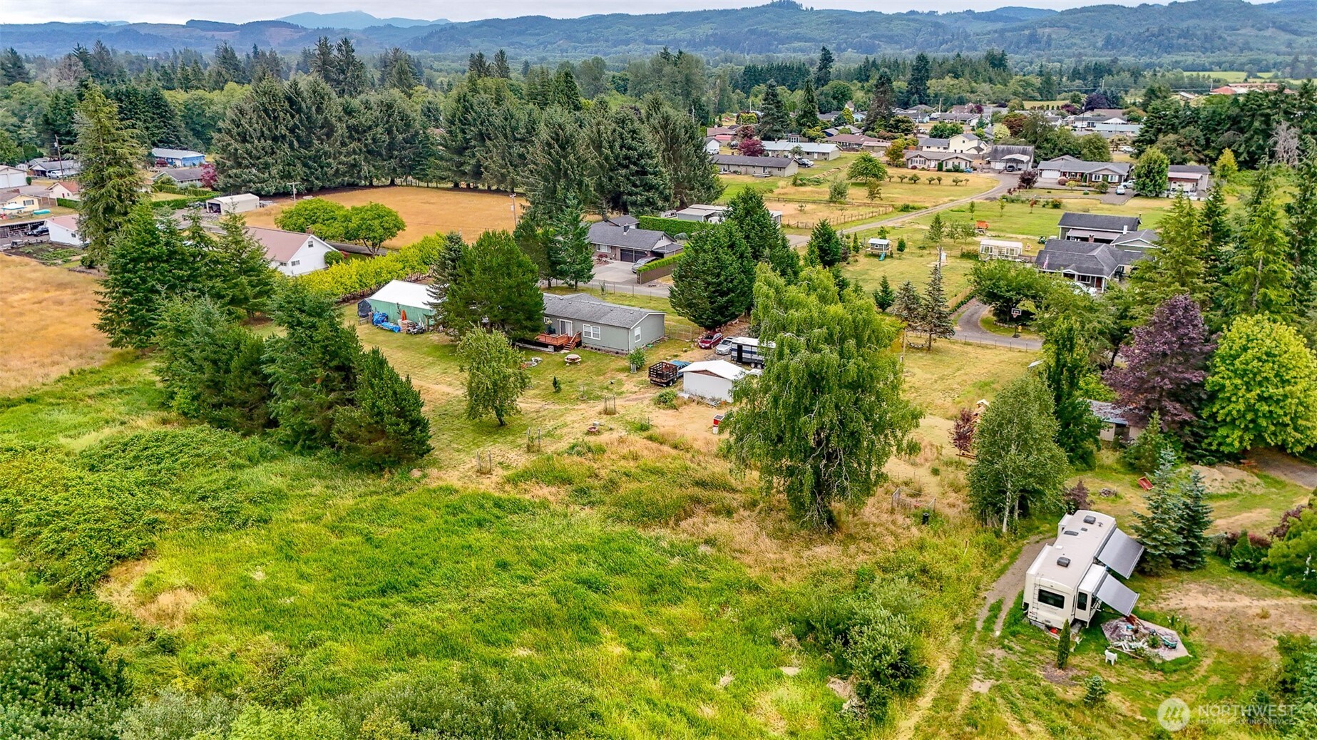 23 Garden Tracts Road Montesano, WA 98563 - Photo 4 of 22 an aerial view of a houses with a lush green hillside