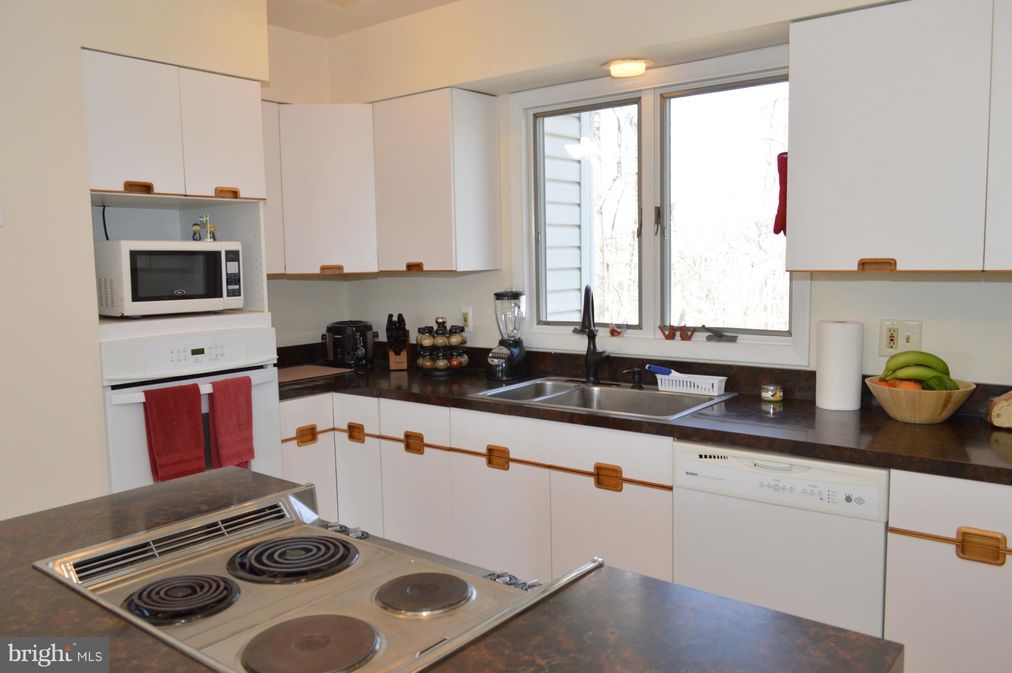 Center Aisle with Loads of Cabinetry