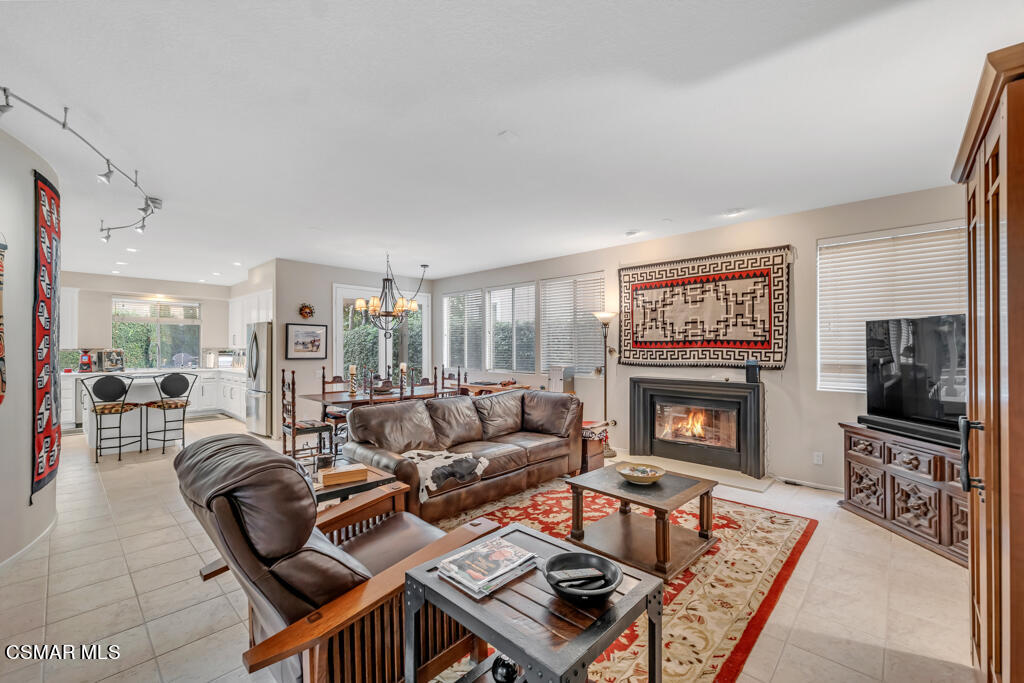 4372 Clearwood Road Moorpark, CA 93021 - Photo 17 of 51 a living room with furniture a flat screen tv and a fireplace
