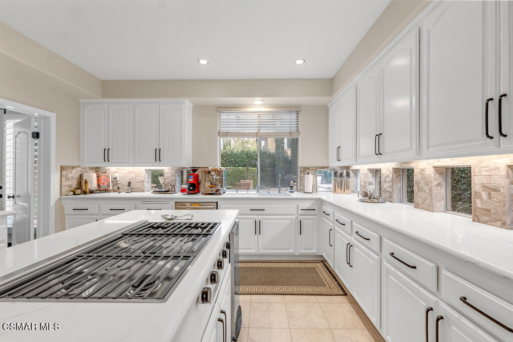 4372 Clearwood Road Moorpark, CA 93021 - Photo 21 of 51 a kitchen with a stove a sink and a refrigerator