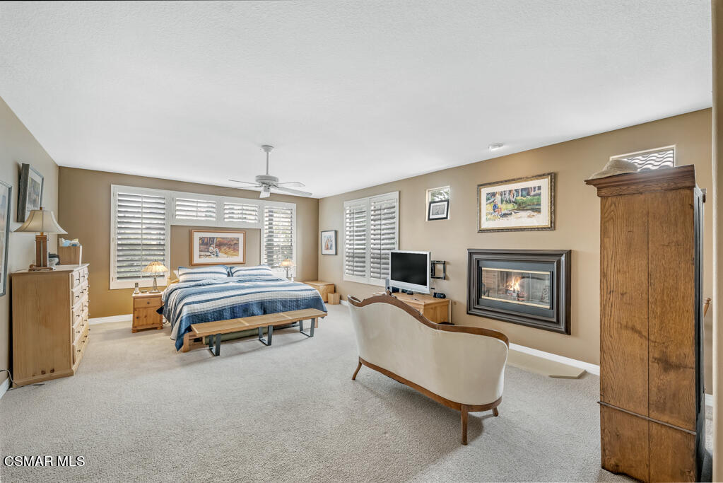 4372 Clearwood Road Moorpark, CA 93021 - Photo 27 of 51 a bedroom with furniture and a fireplace