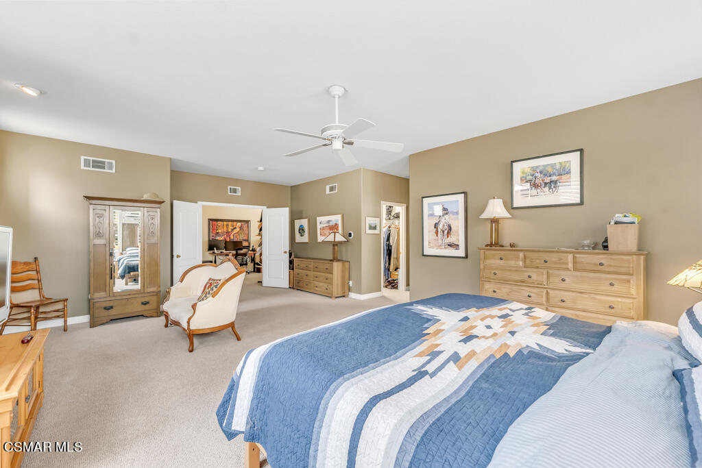 4372 Clearwood Road Moorpark, CA 93021 - Photo 29 of 51 a bedroom with a large bed and wooden floor