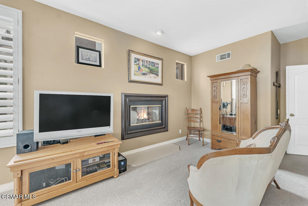4372 Clearwood Road Moorpark, CA 93021 - Photo 30 of 51 a living room with furniture and a flat screen tv
