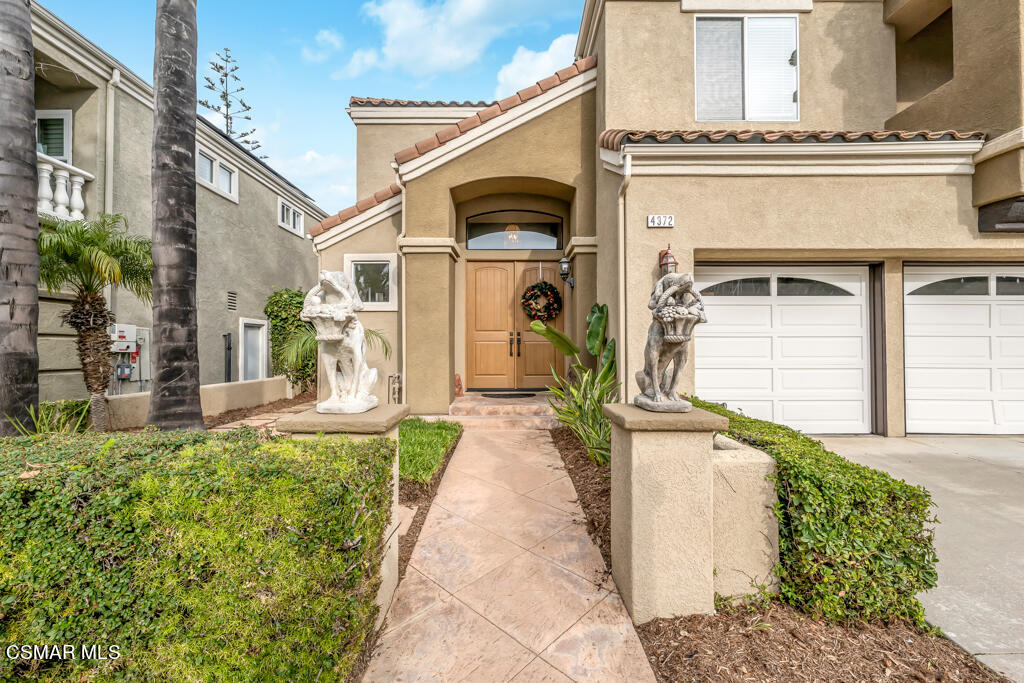 4372 Clearwood Road Moorpark, CA 93021 - Photo 3 of 51 a front view of a house with a garden