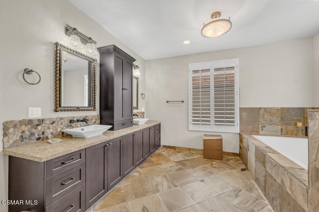4372 Clearwood Road Moorpark, CA 93021 - Photo 32 of 51 a spacious bathroom with a tub sink and mirror