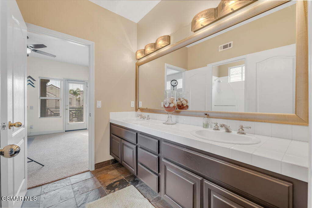 4372 Clearwood Road Moorpark, CA 93021 - Photo 37 of 51 a bathroom with a granite countertop sink and a mirror
