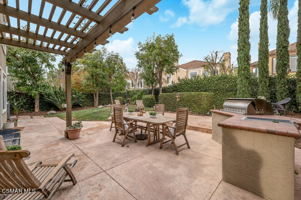 4372 Clearwood Road Moorpark, CA 93021 - Photo 42 of 51 a view of a patio with chairs and a table