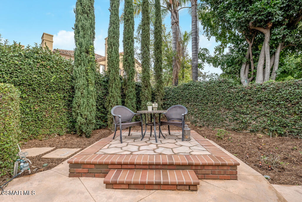 4372 Clearwood Road Moorpark, CA 93021 - Photo 43 of 51 a view of a patio with table and chairs and potted plants