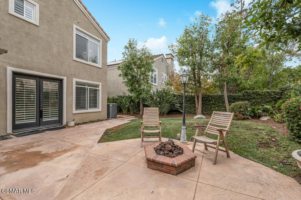 4372 Clearwood Road Moorpark, CA 93021 - Photo 47 of 51 a view of a chair and tables in the back yard of the house
