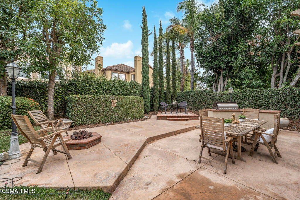 4372 Clearwood Road Moorpark, CA 93021 - Photo 50 of 51 a patio with water view fountain and a table and chairs