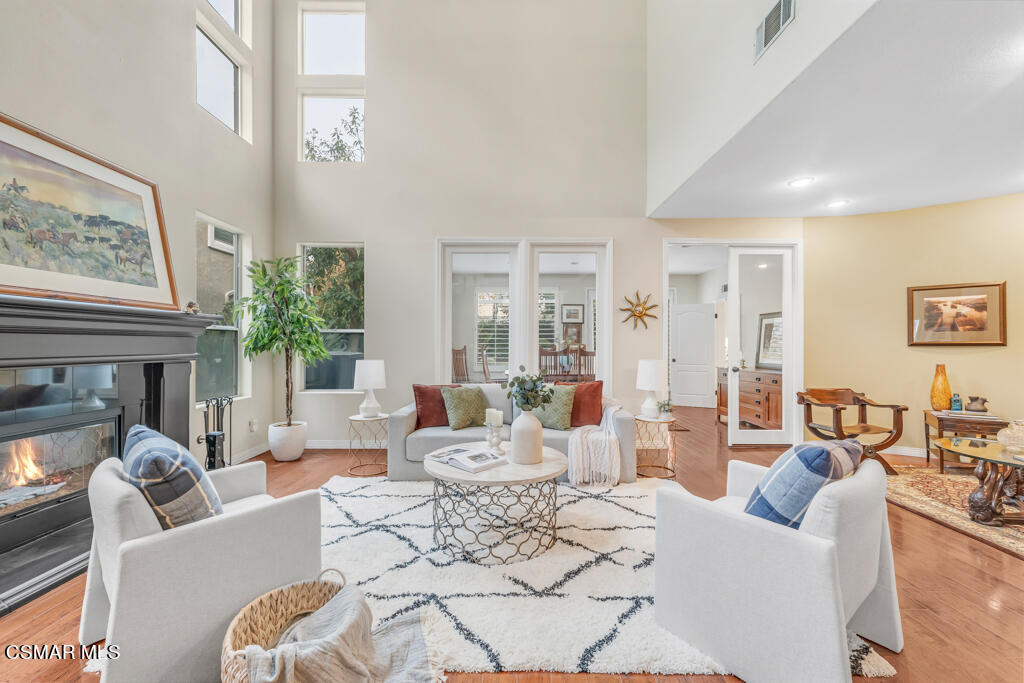 4372 Clearwood Road Moorpark, CA 93021 - Photo 10 of 51 a living room with fireplace furniture and a large window