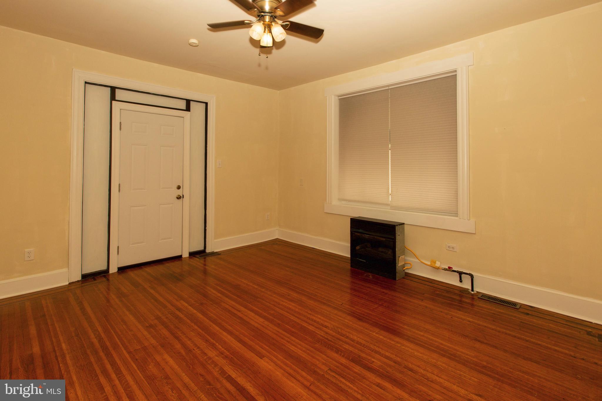 334-1-f East Main Street, Unit 1F Collegeville, PA 19426 - Photo 2 of 10 a view of empty room with wooden floor and fan