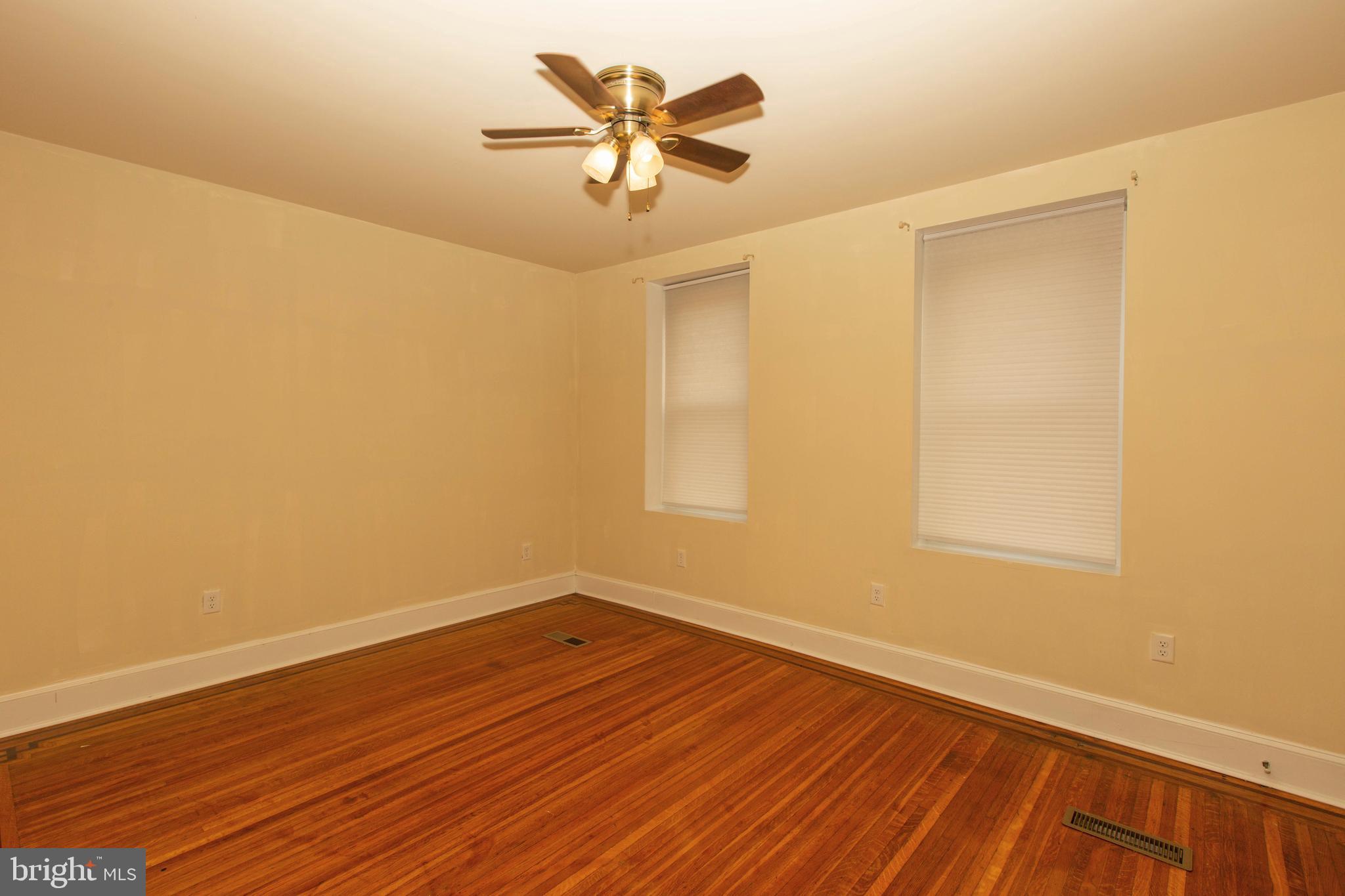 334-1-f East Main Street, Unit 1F Collegeville, PA 19426 - Photo 7 of 10 a view of a room with wooden floor and a ceiling fan