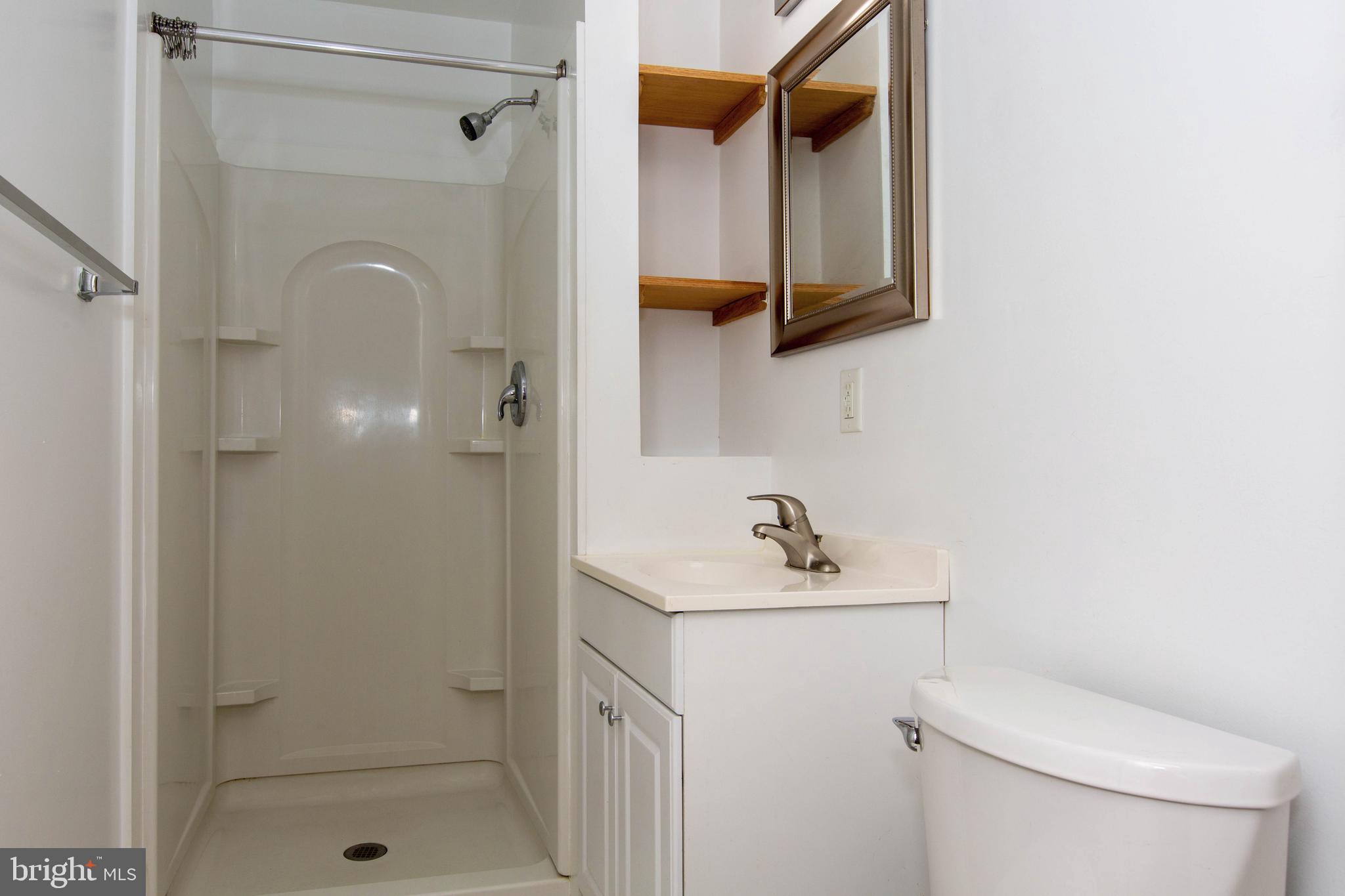 334-1-f East Main Street, Unit 1F Collegeville, PA 19426 - Photo 9 of 10 a bathroom with a sink toilet and shower