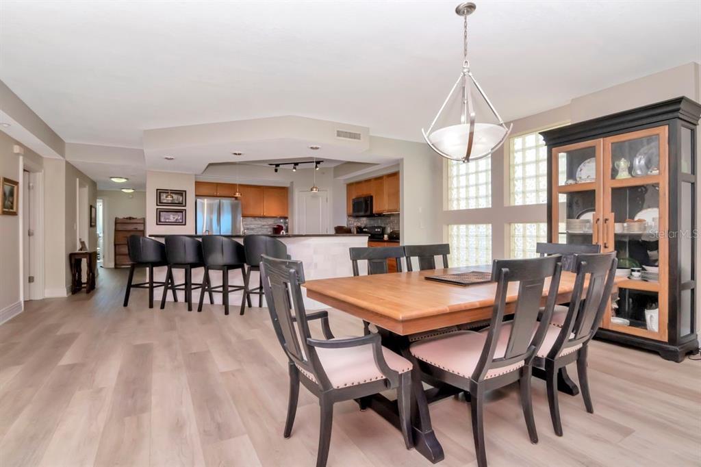 1350 Gulf Boulevard, Unit 301 Clearwater Beach, FL 33767 - Photo 12 of 75 a view of a dining room with furniture window and wooden floor