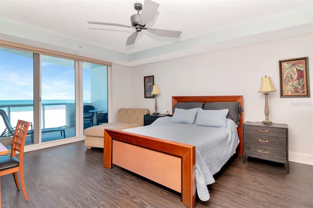 1350 Gulf Boulevard, Unit 301 Clearwater Beach, FL 33767 - Photo 17 of 75 a bedroom with a bed and a large window