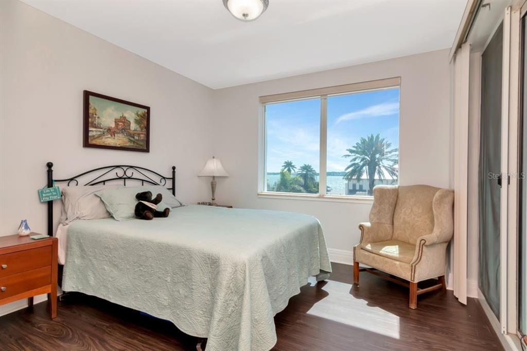 1350 Gulf Boulevard, Unit 301 Clearwater Beach, FL 33767 - Photo 30 of 75 a bedroom with a bed and a couch