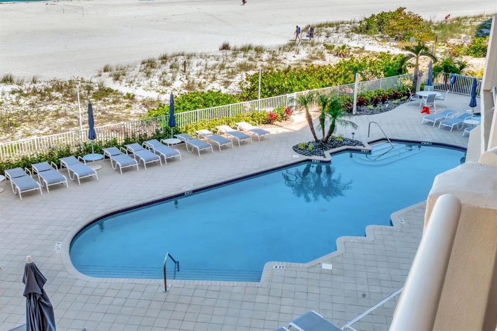 1350 Gulf Boulevard, Unit 301 Clearwater Beach, FL 33767 - Photo 38 of 75 a view of a chairs and table in the terrace