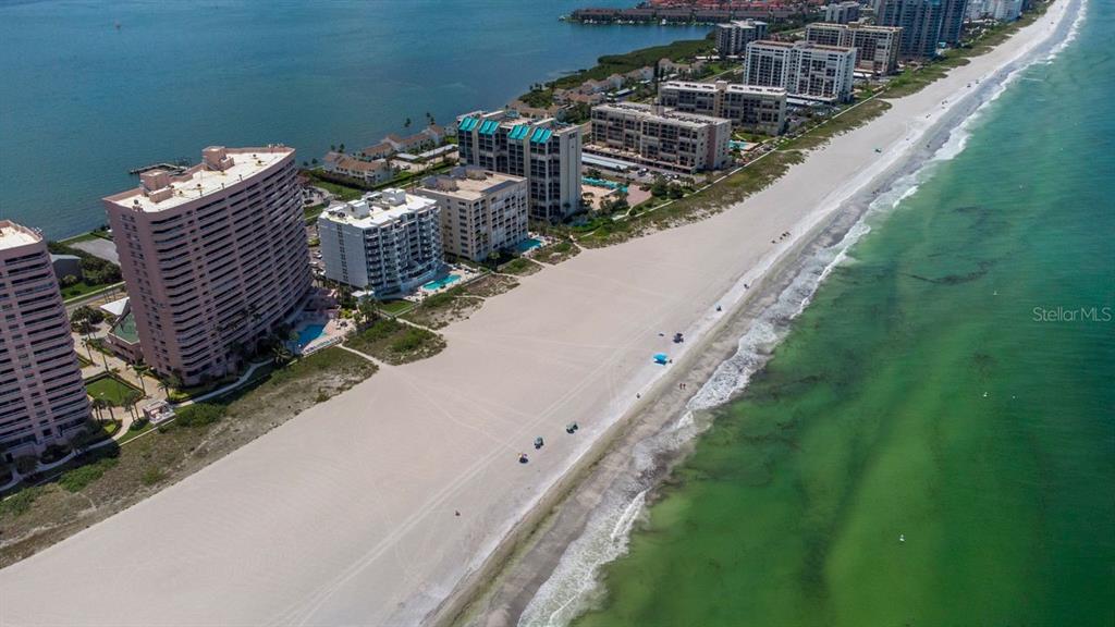 1350 Gulf Boulevard, Unit 301 Clearwater Beach, FL 33767 - Photo 57 of 75 a view of a yard with two chairs