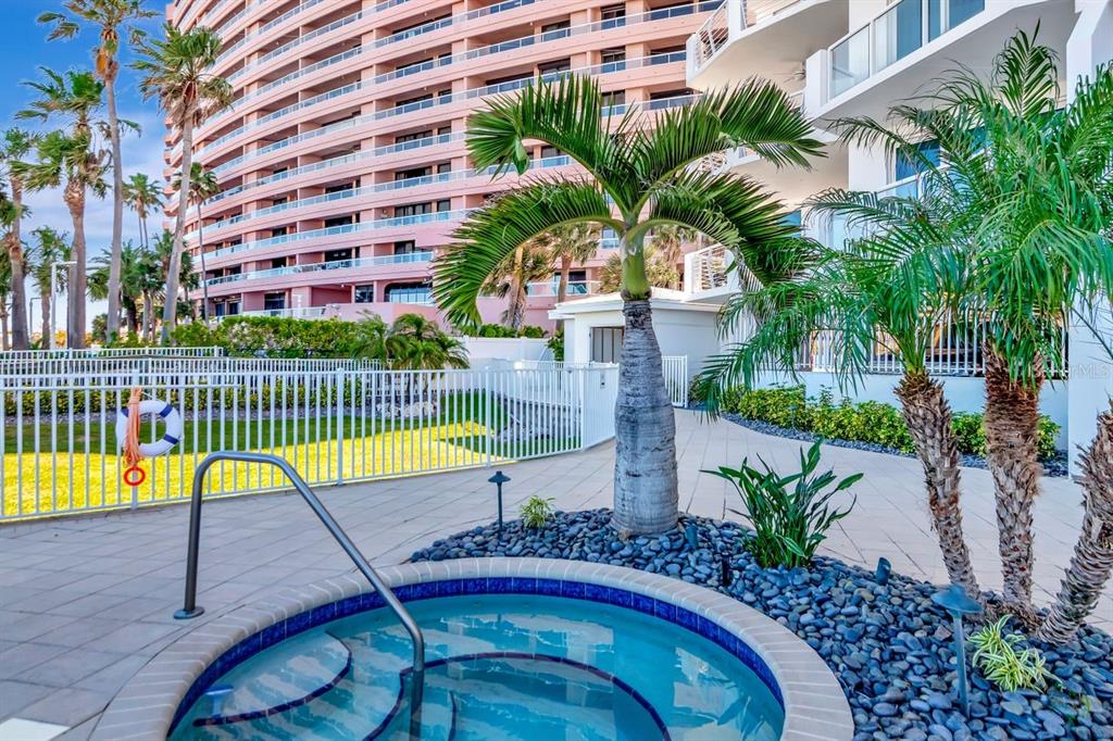 1350 Gulf Boulevard, Unit 301 Clearwater Beach, FL 33767 - Photo 65 of 75 a view of a swimming pool with a patio and a swimming pool