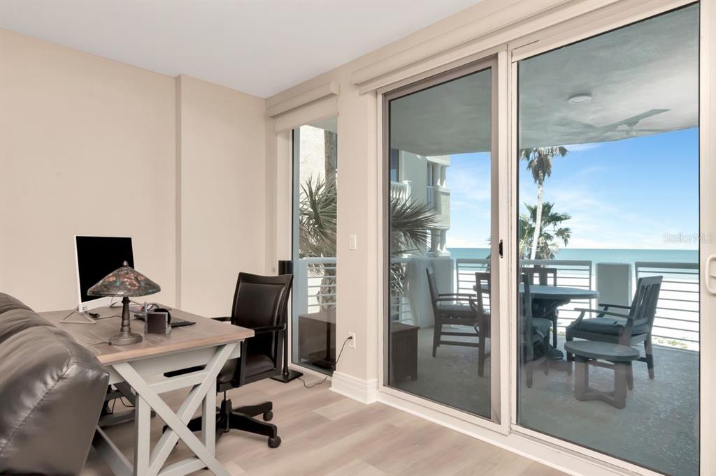 1350 Gulf Boulevard, Unit 301 Clearwater Beach, FL 33767 - Photo 7 of 75 a view of a workspace with furniture and a window