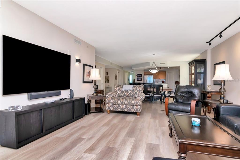 1350 Gulf Boulevard, Unit 301 Clearwater Beach, FL 33767 - Photo 8 of 75 a living room with furniture and a flat screen tv