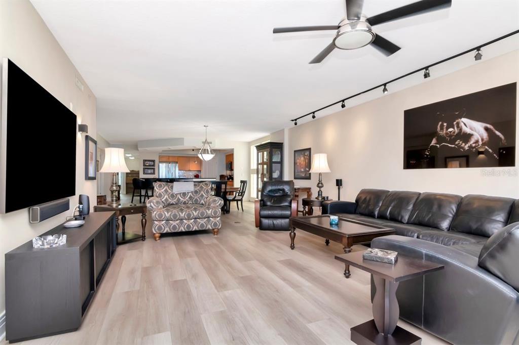 1350 Gulf Boulevard, Unit 301 Clearwater Beach, FL 33767 - Photo 9 of 75 a living room with furniture and a flat screen tv