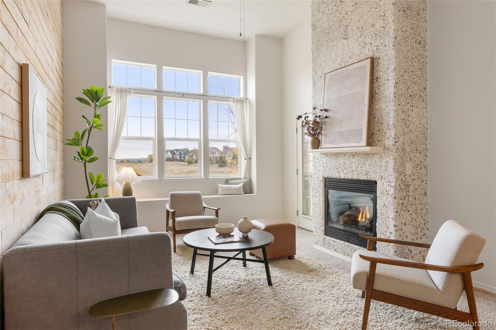 8420 Canyon Rim Trail, Unit 305 Parker, CO 80134 - Photo 1 of 44 a living room with furniture fireplace and window