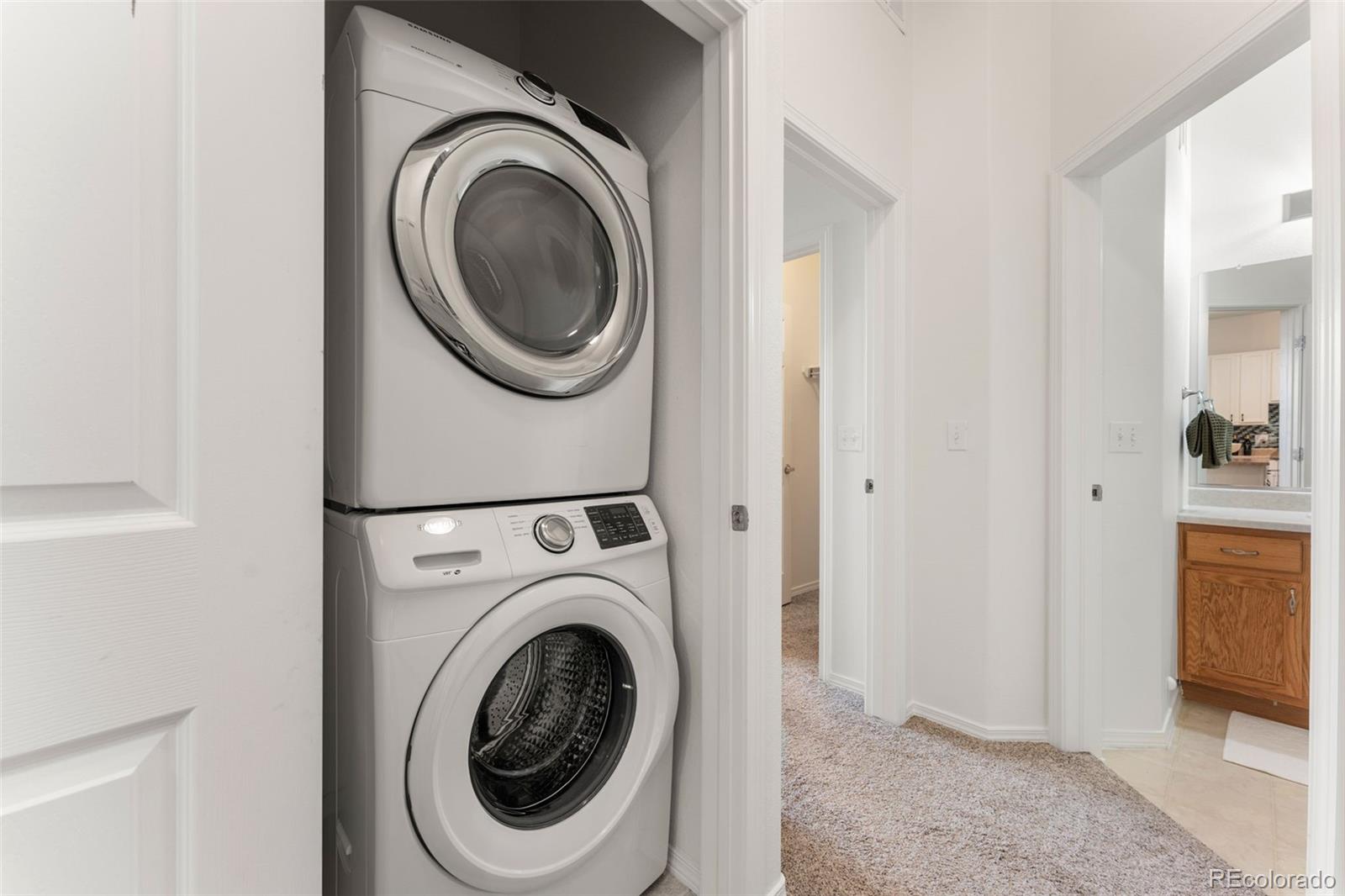 8420 Canyon Rim Trail, Unit 305 Parker, CO 80134 - Photo 22 of 44 a utility room with dryer and washer