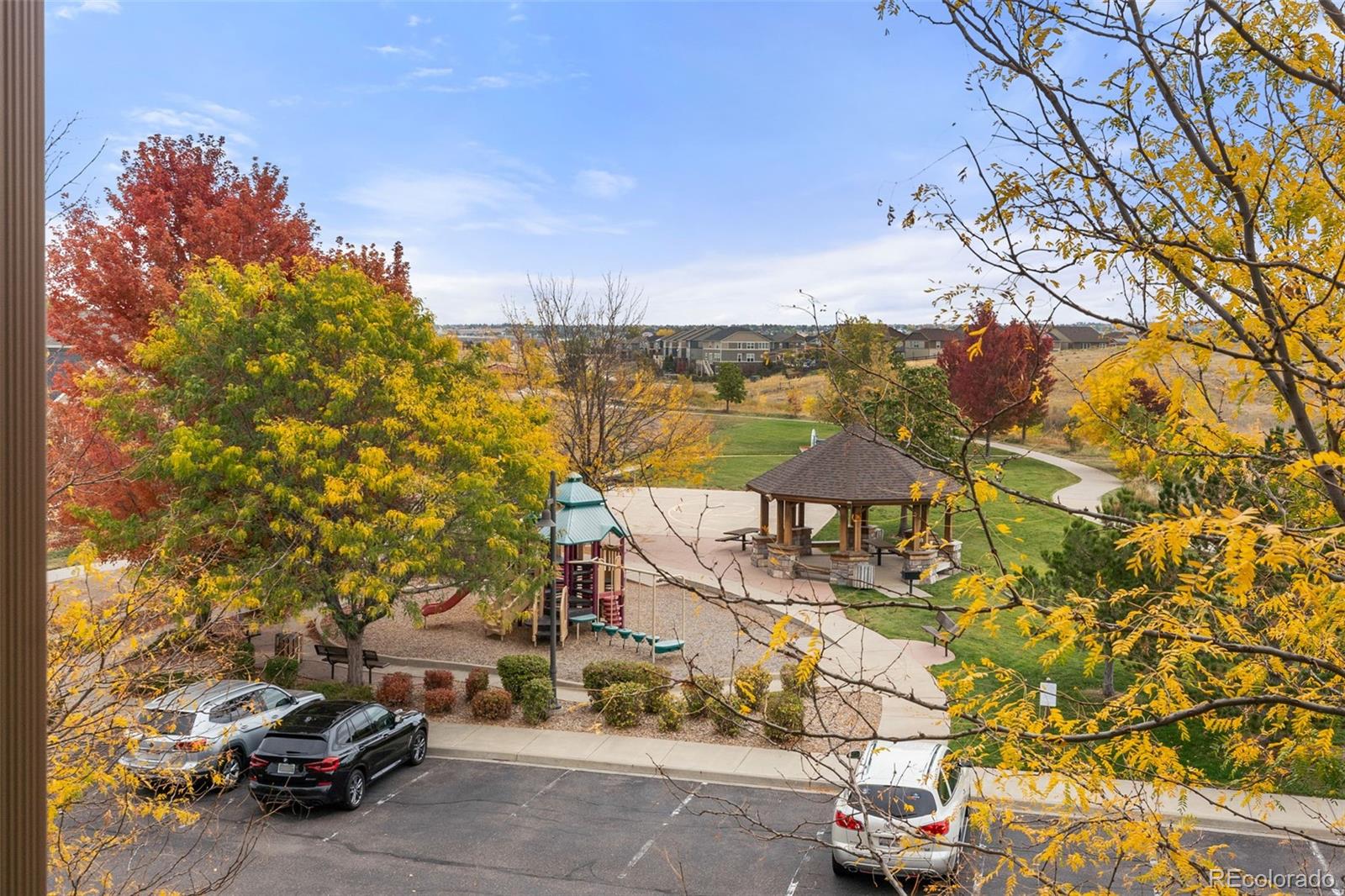 8420 Canyon Rim Trail, Unit 305 Parker, CO 80134 - Photo 24 of 44 a view of a city street from a bench