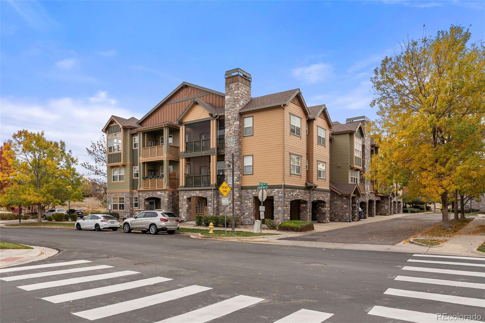 8420 Canyon Rim Trail, Unit 305 Parker, CO 80134 - Photo 31 of 44 a city street with a building in the background