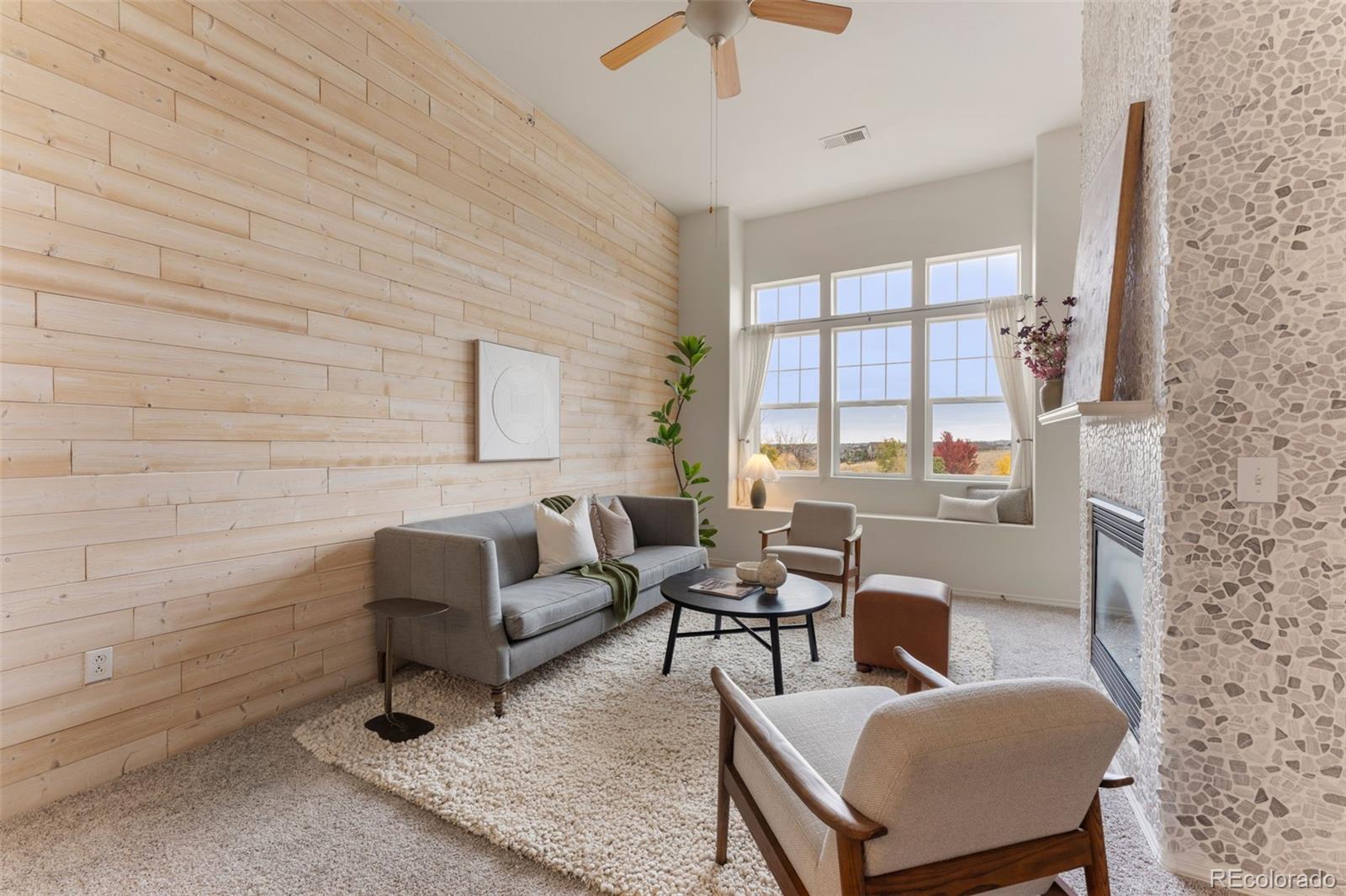 8420 Canyon Rim Trail, Unit 305 Parker, CO 80134 - Photo 35 of 44 a living room with furniture and a potted plant