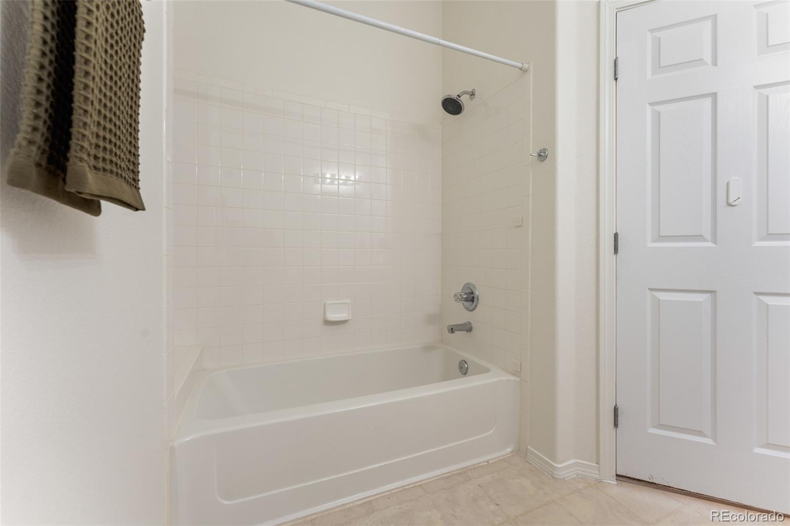 8420 Canyon Rim Trail, Unit 305 Parker, CO 80134 - Photo 42 of 44 a bathroom with a bathtub