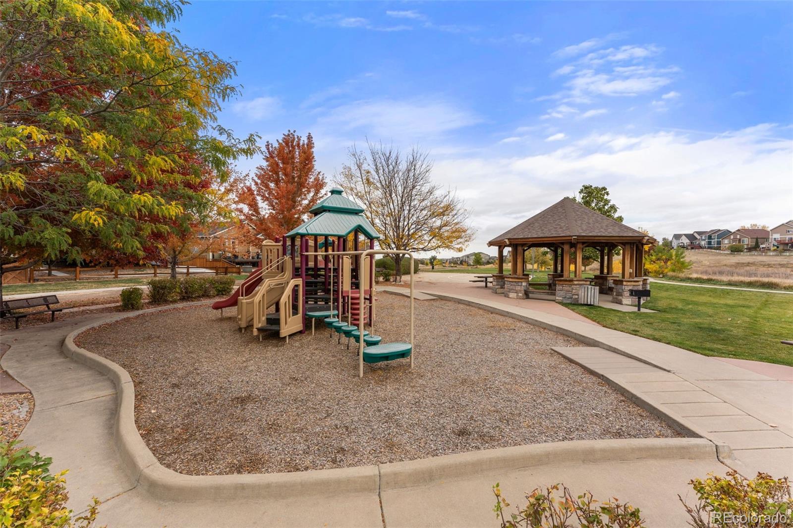8420 Canyon Rim Trail, Unit 305 Parker, CO 80134 - Photo 43 of 44 a view of a park with swings