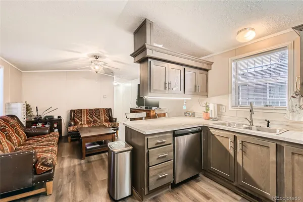 a kitchen with a sink stove and cabinets