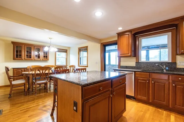 a bedroom with a bed and windows