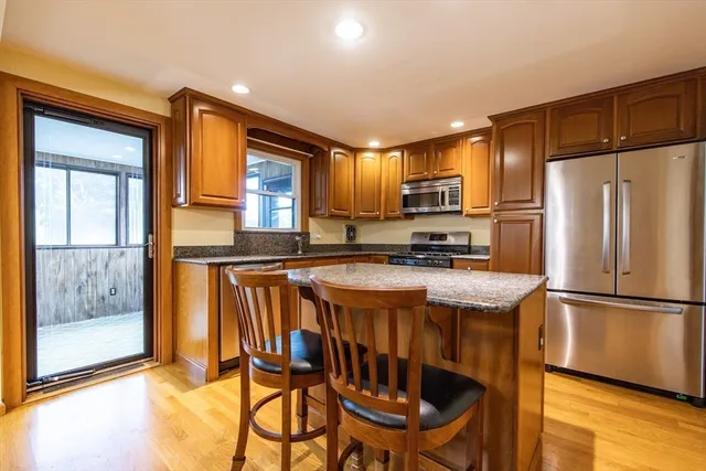 a bedroom with a bed and a dresser in it